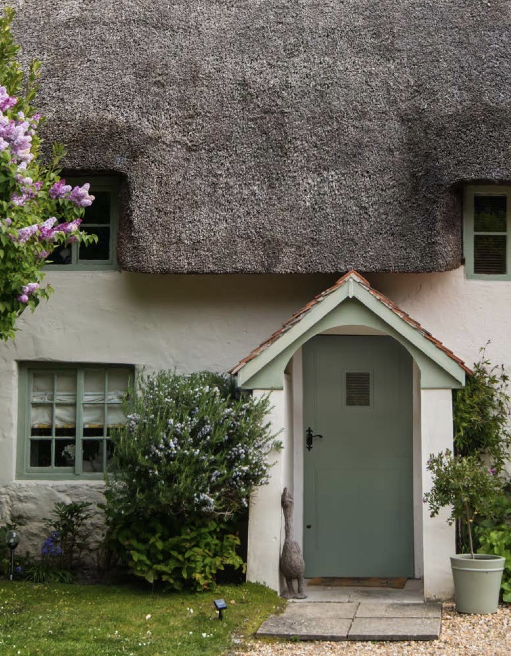 Traditional painted entrance door on a thatched cottage