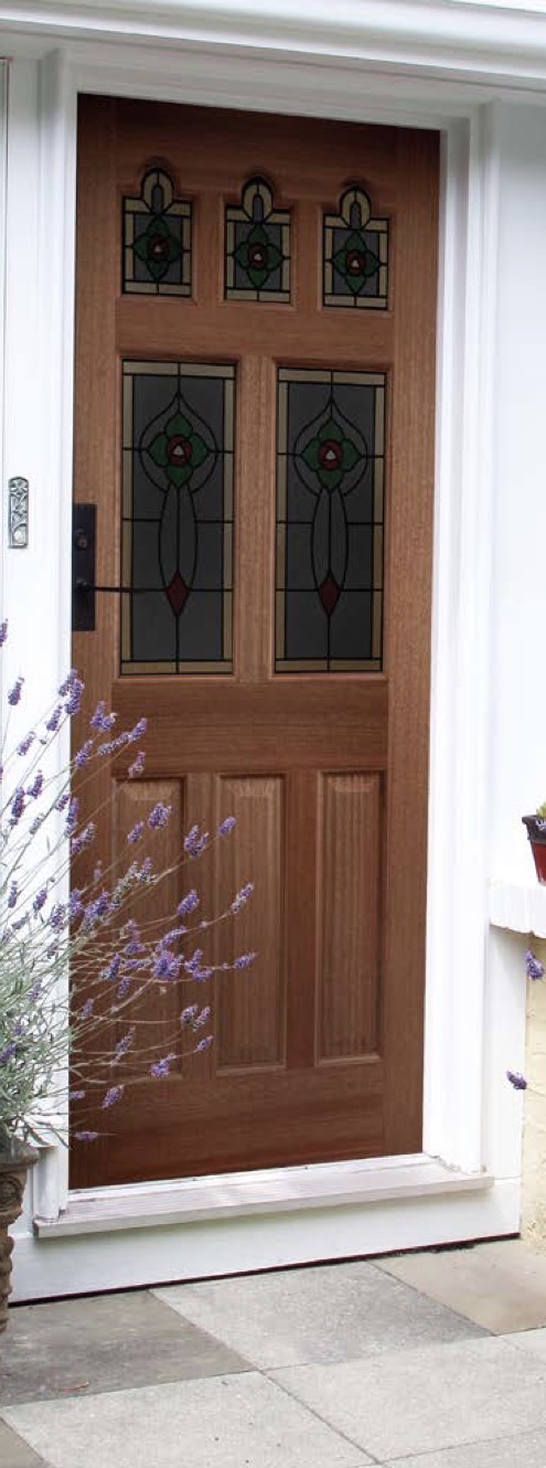 Hardwood entrance door with decorative stained glass panels