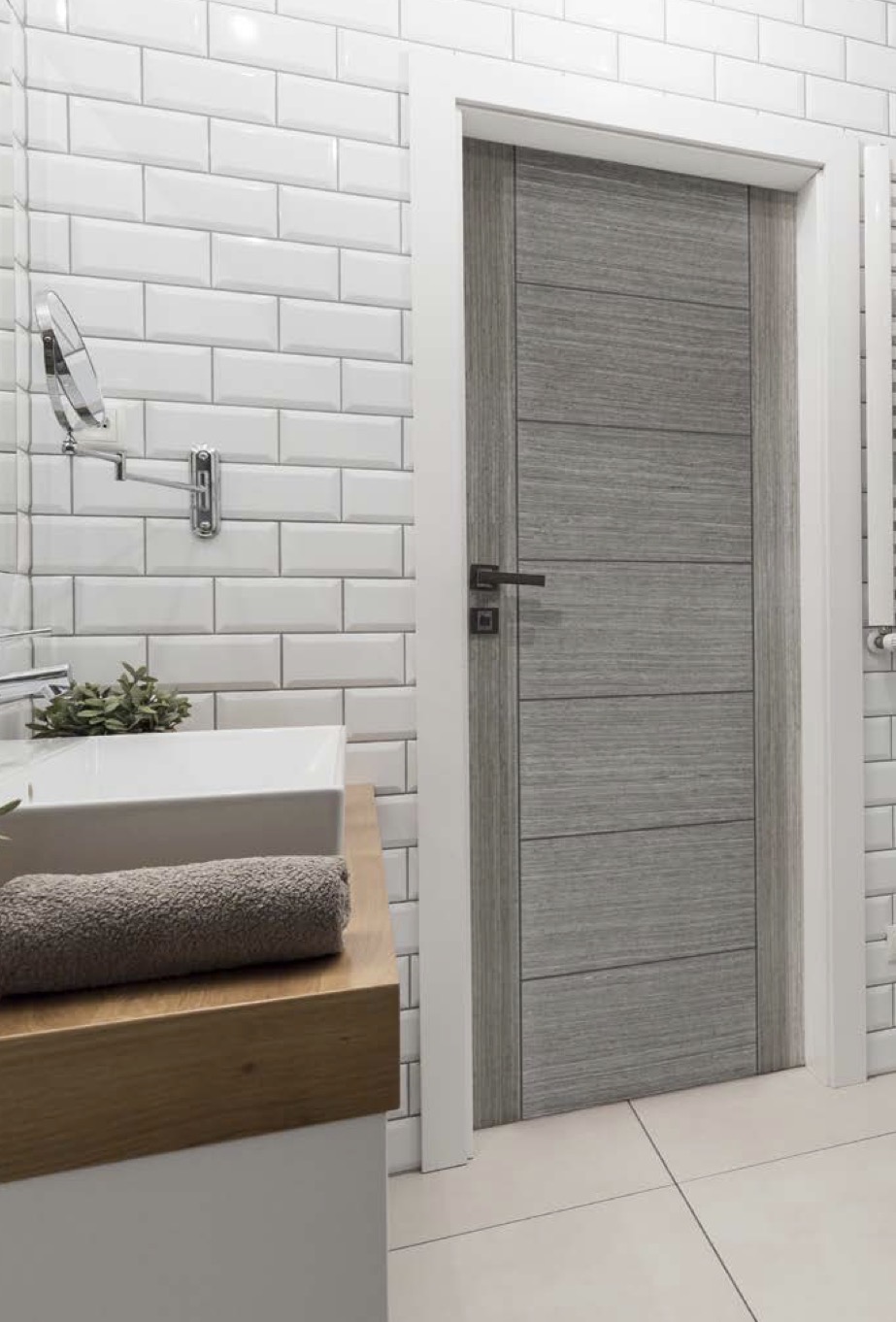 Contemporary grey internal door fitted in a bathroom